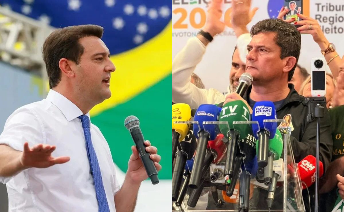Um político discursa diante da bandeira do Brasil; à direita, outro cercado de microfones de imprensa na eleição de 2026.